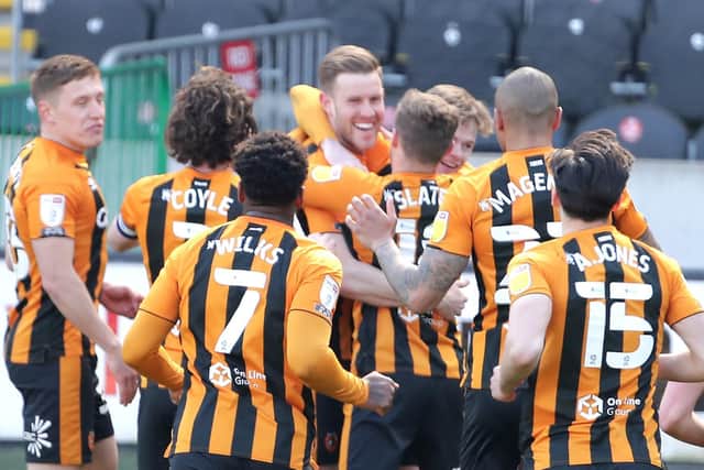 STAYING TOP: Hull City players celebrate after taking the lead against Northampton Town. Picture: Richard Sellers/PA Wire.