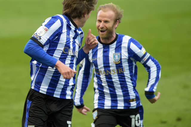MAN OF THE MATCH: Barry Bannan celebrates with two-goal Adam Reach (left)