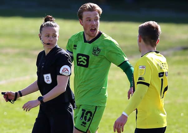 WATCH IT: Referee Rebecca Welch (left) speaks with Port Vale's Tom Conlon and Harrogate Town's Lloyd Kerry. Picture: Nigel French/PA