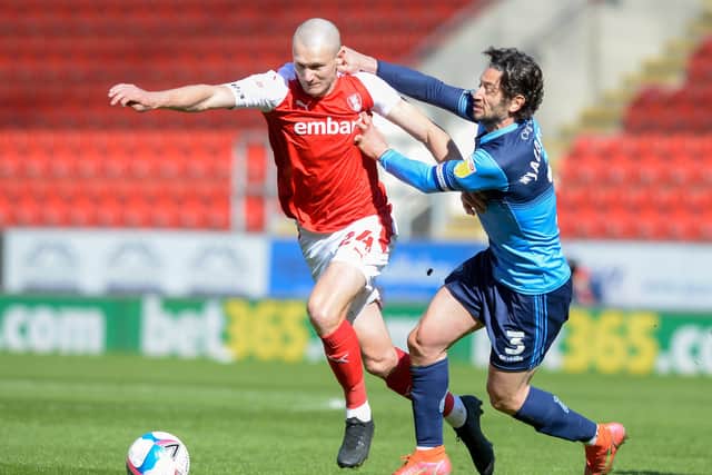 Rotherham United's Michael Smith gets away from Wycombe's grappling Joe Jacobson. Picture: Dean Atkins.