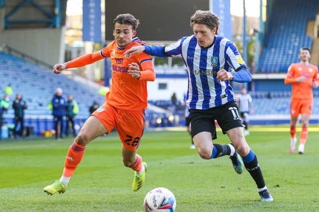 ONE-SIDED: Sheffield Wednesday's Adam Reach (right) and Cardiff City's Tom Sang battle for the ball at Hillsborough. Picture: Isaac Parkin/PA