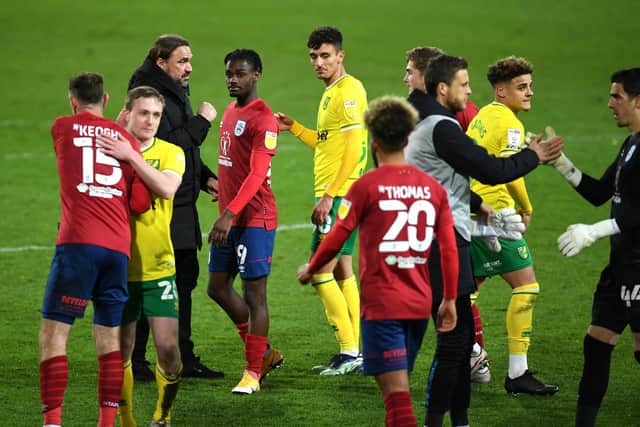 Hard to take: Huddersfield Town players at the end of last night's humbling by Championship champions-elect Norwich City. Picture: Joe Giddens/PA Wire.