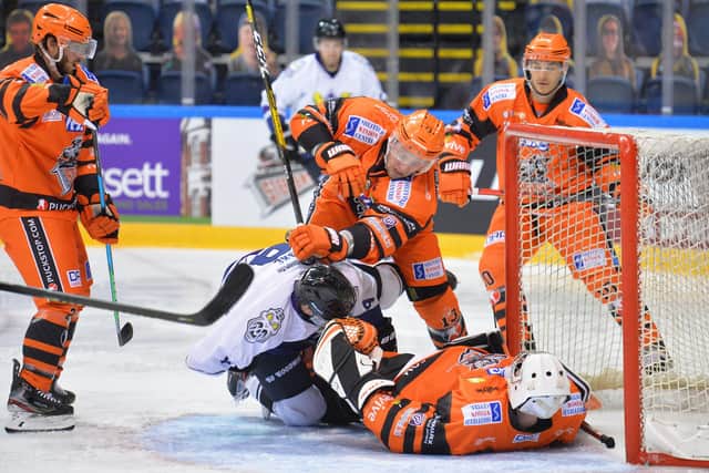 FLAT OUT: Ben Churchfield keeps out the puck during sunday's 5-4 loss to Manchester Storm. Picture: Dean Woolley.