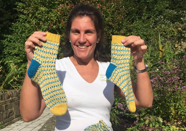 Dr Sarah Holmes who raised £50,000 by running and knitting for Marie Curie