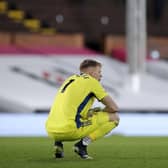 TOUGH TIMES: Sheffield United goalkeeper Aaron Ramsdale crouches dejected during the Premier League match at Craven Cottage. Picture: Andrew Couldridge/PA