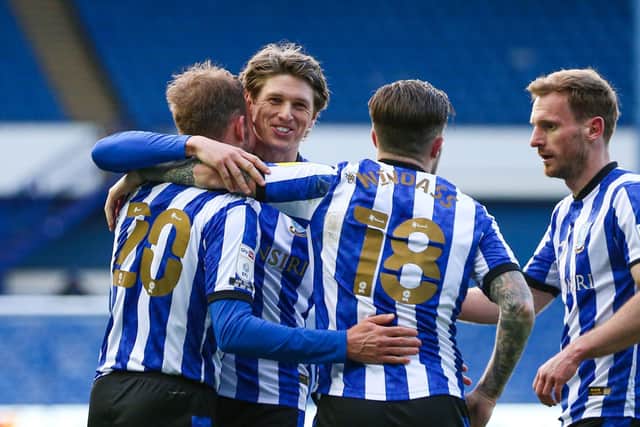 Adam Reach celebrates with Sheffield Wednesday team-mate Jordan Rhodes after scoring their side's fourth goal against Cardiff at Hillsborough. Picture: Isaac Parkin/PA