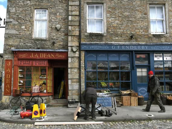 Two of Grassington's shops have become a greengrocer's and a hosier's