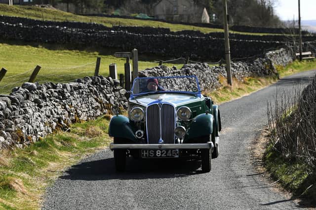A 1930s car seen being driven to the set near Kettlewell