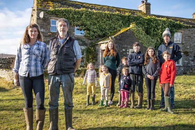 Amanda and Clive Owen with their children Annas, Clemmy, Raven, Sidney, Nancy, Miles, Edith, Violet and Reuben outside Ravenseat Farm. Photo: Renegade Pictures.