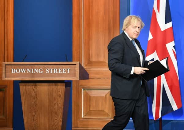 Boris Johnson leaves this week's Downing Street press conference.
