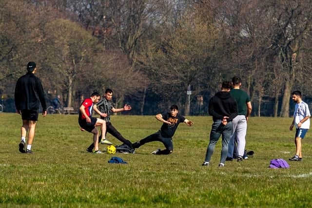 Young people playing football on Harrogate's Stray during the lockdown. Photo: James Hardisty.