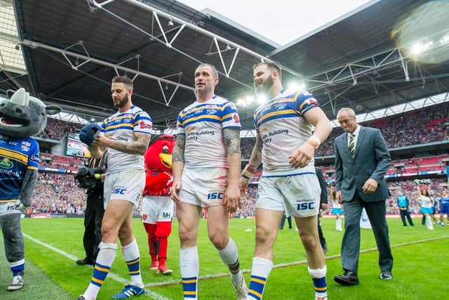 Leeds Rhinos' Adam Cuthbertson with Jamie Peacock and Mitch Aichurch after their record-breaking 50-0 Challenge Cup final win over Hull KR in 2015. (Allan McKenzie/SWpix.com)