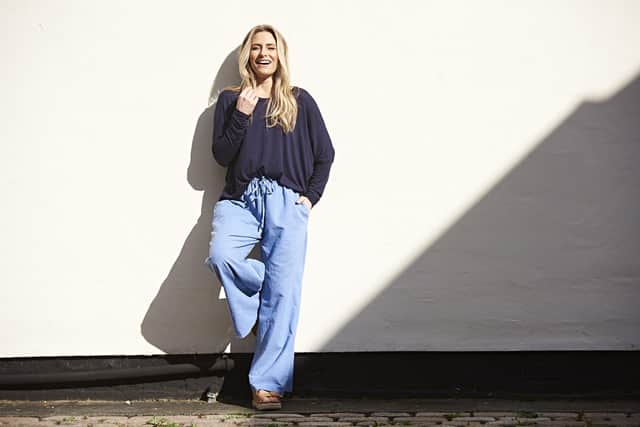 Anna wears Made in Italy basic sweat in navy, £15; Caroun wide-leg trousers in linen/cotton, £30,