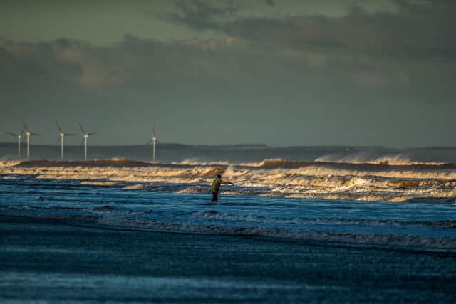 A fisherman braves the bitterly cold Yorkshire Coast weather to cast his line out to sea on the shores of Hornsea. Picture: James Hardisty.