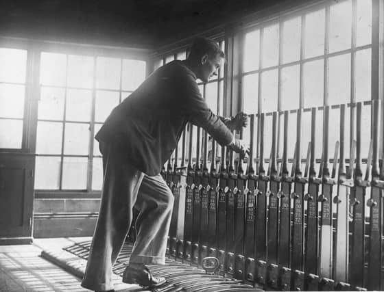 5th May 1926: A volunteer pulling the signal for an incoming train at Scarborough during the Great Strike. (Photo by Edward G. Malindine/Topical Press Agency/Getty Images)