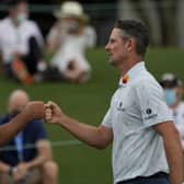 Well done: Justin Rose is congratulated by Matt Kuchar, left, on the 18th green after their first round at the Masters. Pictures: AP Photo/Matt Slocum