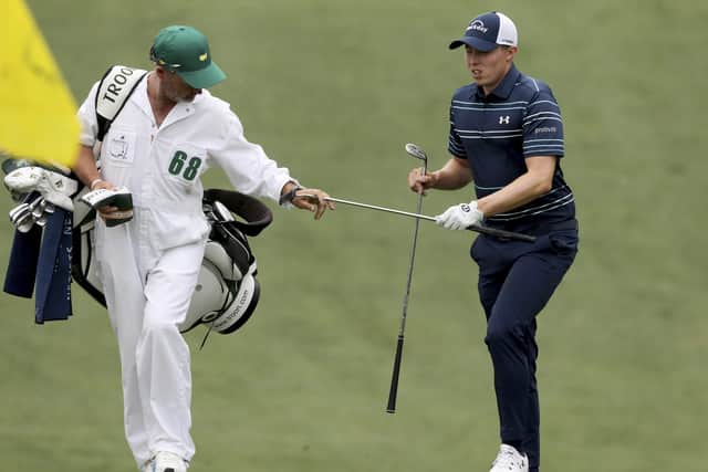 Yorkshire duo: Matthew Fitzpatrick gets his putter from caddie Billy Foster on the 10th hole.