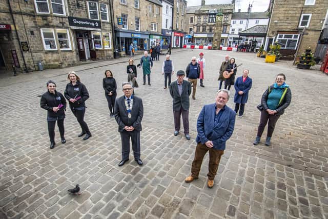 Simon Raybould, chair of Otley Chamber of Trade and Commerce, front left with  Paul Carter, chair of Otley Town Council’s trade and tourism committee, front right,  joined by traders in the West Yorkshire town as they prepare to reopen their doors.   Picture: Tony Johnson