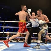 TOP OF THE WORLD: Josh Warrington gets in a last big punch on Sofiane Takoucht  before the referee moves in to stop the fight at Leeds Arena in October 2019. Picture: Steve Riding.
