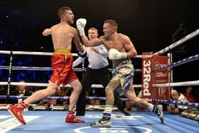 TOP OF THE WORLD: Josh Warrington gets in a last big punch on Sofiane Takoucht  before the referee moves in to stop the fight at Leeds Arena in October 2019. Picture: Steve Riding.