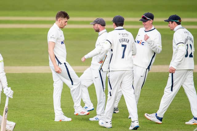VITAL SPELL: Yorkshire's Ben Coad, seen celebrating the wicket of Glamorgan's Kiran Carlson, took three visitors' wickets before the close of play. Picture by Allan McKenzie/SWpix.com
