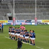 The sides stand for a minute's silence in memory of the Duke of Edinburgh before Catalans' Cup win over Trinity. Picture by SWpix.com