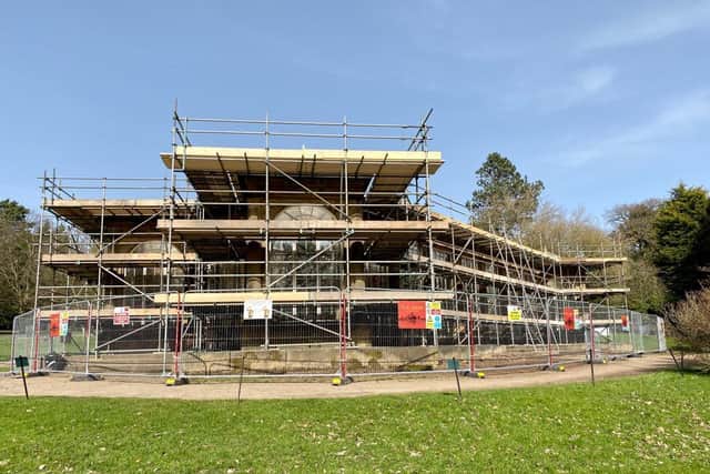 The Camellia House encased in scaffolding during its restoration