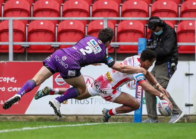 In the corner: St Helens' Regan Grace scores against Leeds Rhinos. Picture by Alex Whitehead/SWpix.com