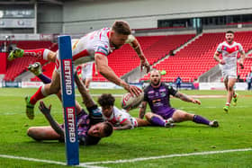 Diving in:  St Helens' Tommy Makinson scores a try. Picture: Alex Whitehead/SWpix.com