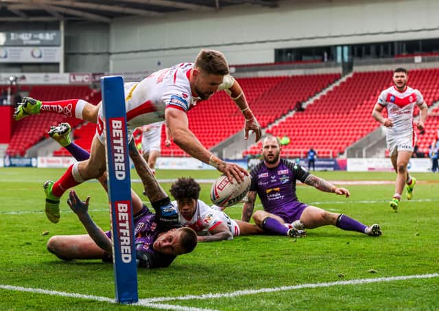 Diving in:  St Helens' Tommy Makinson scores a try. Picture: Alex Whitehead/SWpix.com