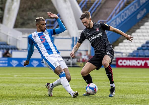 Huddersfield Town's Juninho Bacuna challenges Millers' Lewis Wing. Picture Tony Johnson
