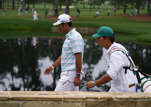 Leading the way: Hideki Matsuyama walks on the 15th hole with caddie Shota Hayafuji. Pictures: AP Photo/Matt Slocum