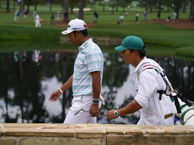 Leading the way: Hideki Matsuyama walks on the 15th hole with caddie Shota Hayafuji. Pictures: AP Photo/Matt Slocum