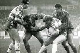 Doncaster's Graham Idle and Carl Hall (right) combine to stop Wigan's progress during their Cup tie at Central Park, January 1990.