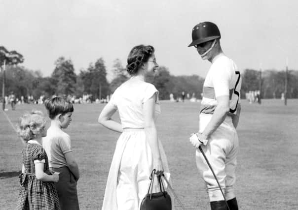 Prince Philip (right) was a great polo enthusiast - this picture with the Queen comes from 1956.