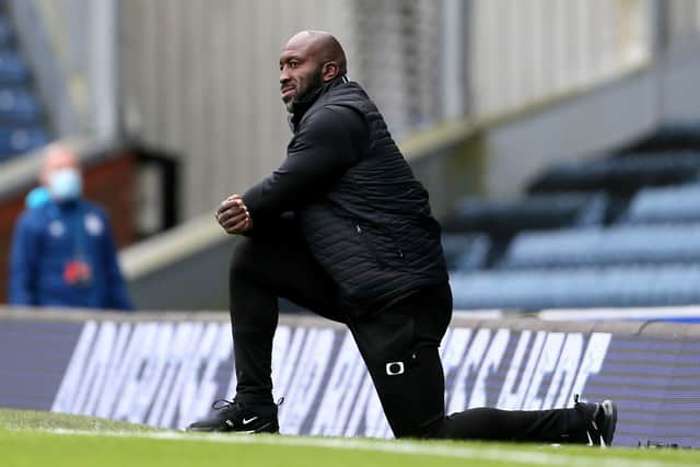 Now Sheffield Wednesday manager Darren Moore takes a knee before the Carabao Cup match at Ewood Park against Blackburn when he was in charge of Doncaster (Picture: PA)