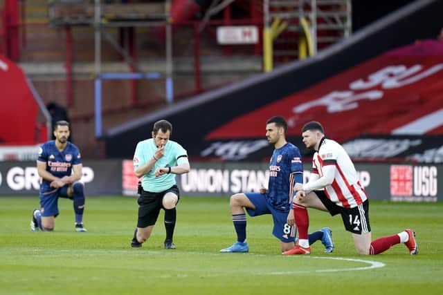 Sheffield United and Arsenal players take a knee prior to the Premier League match at at Bramall Lane on Sunday night (Picture: PA)