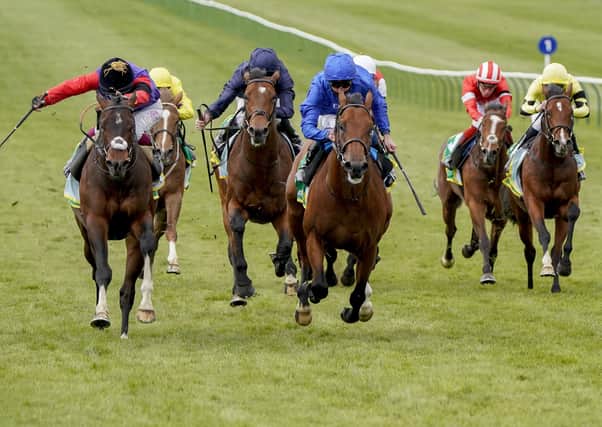 Oisin Murphy and Tactical (left) provide a poignant win for the Queen at Newmarket.