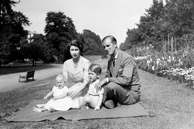A touching photo of then Princess Elizabeth and Prince Philip, with Prince Charles and Princess Anne, in 1951.
