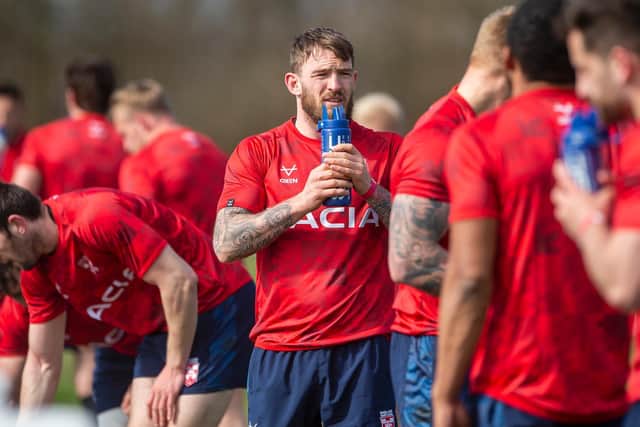 England's Daryl Clark takes a break in training this week with Jake Wardle, left. (ALLAN MCKENZIE/SWPIX)