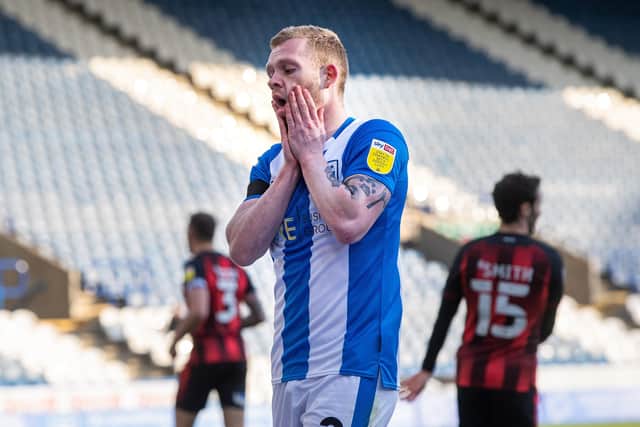 Lewis O'Brien after his shot somehow comes back out off the post during Huddersfield Town's defeat to Bournemouth (Picture: Bruce Rollinson)