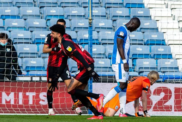 Back in triumph: Former Huddersfield player Philip Billing celebrates scoring Bournemouth's opener at the  John Smith's Stadium.  Picture: Bruce Rollinson
