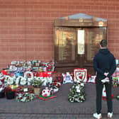 Jordan Henderson pays his respects at the Hillsborough memorial outside Liverpool Football Club's Anfield ground.