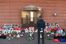 Jordan Henderson pays his respects at the Hillsborough memorial outside Liverpool Football Club's Anfield ground.