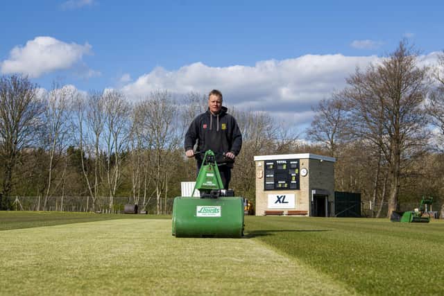 Groundsman James Nixon prepares the wicket at Woodlands Cricket Club in Oakenshaw (Picture: Tony Johnson)