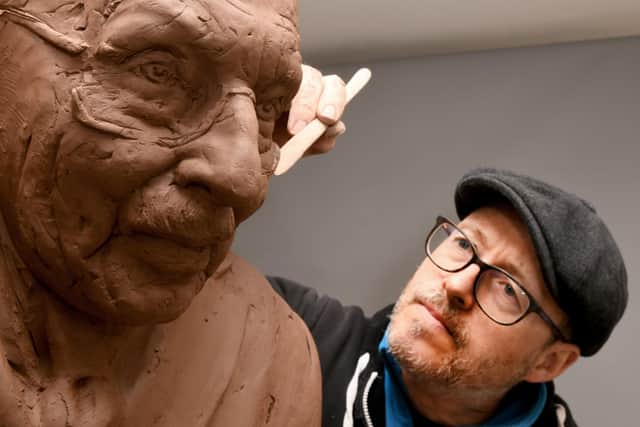 Artist Andrian Melka at work on the sculpture of Captain Sir Tom Moore. Picture: Gary Longbottom
