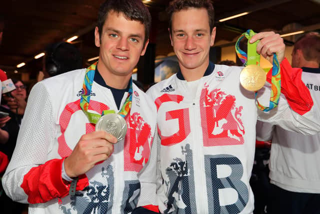 Jonny Brownlee (L) and Alistair Brownlee of Great Britain pose with their medals before a Rio 2016 Victory Parade for the British Olympic and Paralympic teams on October 17, 2016 in Manchester, (Picture: Mark Robinson/Getty Images)