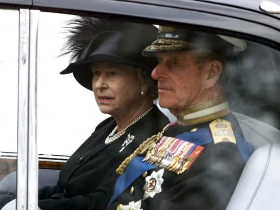 Queen Elizabeth II and Duke of Edinburgh after leaving Westminster Abbey following the funeral service of Queen Elizabeth, the Queen Mother.