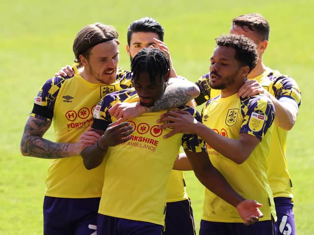 OPENER: Aaron Rowe and his Huddersfield Town teammates celebrate the first goal of the game at Nottingham. Picture: Getty Images.