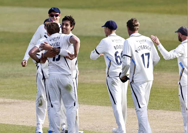 David Willey (L) is congratulated after taking the final Kent wicket. Pictures: Max Flego